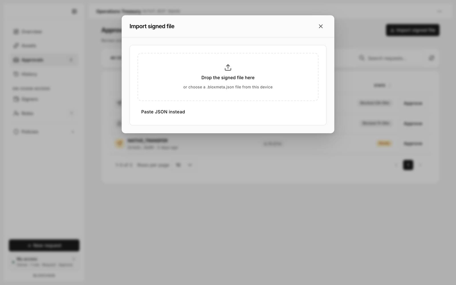 Import signed file dialog with a drop zone, Paste JSON instead, and a preview